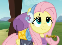 Size: 696x505 | Tagged: safe, screencap, fluttershy, pegasus, pony, dungeons and discords, cropped, cute, discovery family logo, earmuffs, female, happy, lidded eyes, mare, saddle bag, shyabetes, smiling, solo