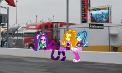 Size: 1276x764 | Tagged: safe, adagio dazzle, aria blaze, sonata dusk, equestria girls, cute, daytona usa, equestria girls in real life, eyes closed, hauler, looking at you, nascar, photo, race track, racing, sign, sitting, sultry pose, the dazzlings, truck