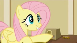 Size: 1674x934 | Tagged: safe, screencap, fluttershy, pegasus, pony, viva las pegasus, cute, female, grin, intercom, mare, raised hoof, shyabetes, smiling