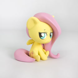 Size: 1000x1000 | Tagged: safe, fluttershy, pegasus, pony, chibi, cute, figurine, sad, shyabetes, sitting, solo, welovefine