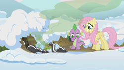 Size: 1280x720 | Tagged: safe, screencap, fluttershy, spike, dragon, pegasus, pony, skunk, winter wrap up, animal, animal team, burrow, clothes, female, male, mare, nose pinch, plugged nose, skunk spray, smell, smelly, smiling, snow, visible stench, winter, winter wrap up vest