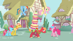 Size: 2000x1125 | Tagged: safe, derpibooru import, screencap, big macintosh, carrot cake, cup cake, fluttershy, pinkie pie, rainbow dash, earth pony, pegasus, pony, mmmystery on the friendship express, balancing, cake, female, flying, food, hard hat, male, mare, marzipan mascarpone meringue madness, ponyville, rope, stallion