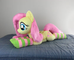 Size: 2453x2000 | Tagged: safe, artist:qtpony, fluttershy, pony, adorable face, bed, bedroom, clothes, cute, fluffy, irl, life size, lying down, photo, plushie, show accurate, shyabetes, socks, solo, striped socks