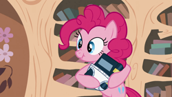 Size: 1366x768 | Tagged: safe, screencap, pinkie pie, earth pony, pony, baby cakes, book, cute, diaper, golden oaks library, scrunchy face, solo