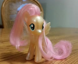 Size: 2243x1836 | Tagged: safe, fluttershy, pegasus, pony, brushable, glitter, irl, photo, solo, toy