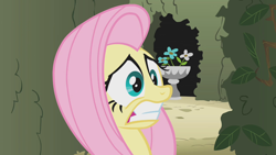 Size: 1280x720 | Tagged: safe, screencap, fluttershy, pegasus, pony, the return of harmony, flower, gritted teeth, maze, plant, scared, solo, wide eyes