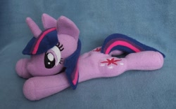 Size: 1024x641 | Tagged: safe, artist:adamar44, derpibooru import, twilight sparkle, beanie (plushie), both cutie marks, irl, photo, plushie, prone, solo