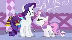 Size: 1280x720 | Tagged: safe, screencap, rarity, sweetie belle, pony, unicorn, angry, argument, clothes, clothes rack, dress, female, filly, hub logo, looking at each other, mare