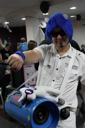 Size: 3456x5184 | Tagged: safe, dj pon-3, vinyl scratch, human, bass cannon, convention, cosplay, hoofbump, irl, irl human, photo, plushie