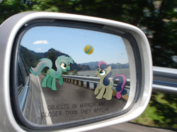 Size: 590x442 | Tagged: safe, artist:php76, bon bon, lyra heartstrings, sweetie drops, ball, bon bon is amused, car, cute, highway, implied lyrabon, irl, lame joke, objects in mirror are closer than they appear, open mouth, photo, playing, ponies in real life, raised hoof, road, smiling, trace, vector