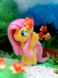 Size: 1500x2007 | Tagged: safe, artist:atelok, fluttershy, pony, felt, flower, flower in hair, irl, looking away, needle felted, no mouth, photo, plushie, solo, spread wings, standing, wings