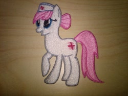Size: 1024x768 | Tagged: safe, artist:ethepony, nurse redheart, earth pony, pony, embroidery, female, mare, patch, pink mane, pink tail, white coat
