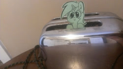 Size: 1280x722 | Tagged: safe, artist:davierocket, lyra heartstrings, pony, unicorn, craft, irl, papercraft, photo, ponies in real life, smiling, solo, tiny ponies, toaster