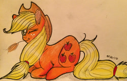 Size: 1024x655 | Tagged: safe, artist:snowfoxythefox, applejack, earth pony, pony, colored pencil drawing, colored sketch, hat, hay bale, lying down, one eye closed, smiling, solo, traditional art, wink