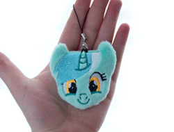 Size: 1314x1000 | Tagged: safe, artist:meplushyou, lyra heartstrings, human, pony, unicorn, charm, female, hand, irl, irl human, looking at you, mare, photo, plushie, smiling