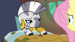 Size: 1920x1080 | Tagged: safe, screencap, fluttershy, zecora, pegasus, pony, zebra, a health of information, bed, discovery family logo, leaves, sick, zecora's hut