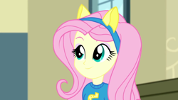 Size: 1280x720 | Tagged: safe, screencap, fluttershy, eqg summertime shorts, equestria girls, steps of pep, canterlot high, clothes, female, pony ears, school spirit, solo, wondercolts