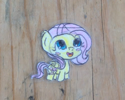 Size: 1280x1024 | Tagged: safe, artist:ladyeleanork, fluttershy, pegasus, pony, blush sticker, blushing, chibi, cropped, folded wings, irl, looking up, open mouth, photo, smiling, solo, traditional art, wings