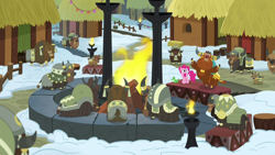 Size: 1280x720 | Tagged: safe, screencap, gummy, pinkie pie, prince rutherford, pony, yak, not asking for trouble, calf, cloven hooves, crowd, crown, fire, firepit, horn ring, hut, jewelry, pit, regalia, snow, yak calf, yakyakistan, yickslubertfest