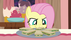 Size: 1280x720 | Tagged: safe, screencap, fluttershy, pegasus, pony, discordant harmony, cute, female, food, mare, sandwich, shyabetes, smiling, solo, soon