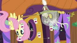 Size: 1280x720 | Tagged: safe, screencap, discord, fluttershy, pegasus, pony, discordant harmony, butterfly net, butterfly sandwich, ginseng teabags, upside down