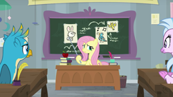 Size: 1280x720 | Tagged: safe, screencap, fluttershy, gallus, silverstream, classical hippogriff, griffon, hippogriff, pegasus, pony, school daze, animal, apple, classroom, desk, drawing, female, food, male, mare, pointer, teacher, teaching