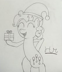 Size: 750x878 | Tagged: safe, artist:herorareheart, pinkie pie, pony, anatomically incorrect, christmas, cutie mark, female, hat, holiday, hoof hold, mare, monochrome, present, santa hat, signature, simple background, sketch, traditional art