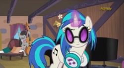 Size: 960x528 | Tagged: safe, screencap, dj pon-3, octavia melody, vinyl scratch, earth pony, pony, slice of life (episode), bipedal, cello, glasses, headphones, magic, musical instrument, piano, raised eyebrow, table, telekinesis