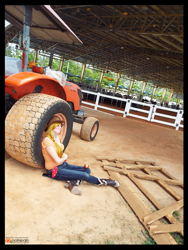 Size: 1728x2304 | Tagged: safe, artist:krazykari, applejack, human, apple, cellphone, clothes, cosplay, costume, food, irl, irl human, phone, photo, sitting, solo, tractor