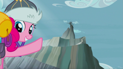 Size: 1343x758 | Tagged: safe, screencap, pinkie pie, earth pony, pony, the lost treasure of griffonstone, abysmal abyss, female, griffonstone, hat, looking back, mare, mountain, peak, pointing, raised hoof, smiling, solo, worm's eye view