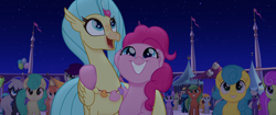 Size: 1920x804 | Tagged: safe, screencap, pinkie pie, princess skystar, classical hippogriff, earth pony, hippogriff, pony, my little pony: the movie, background pony, bell perin, female, flower, hug, jewelry, male, mare, necklace, rainbow (song), seashell, seashell necklace, smiling, stallion, unnamed pony, winghug