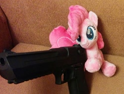 Size: 1000x761 | Tagged: safe, artist:shindeeru, pinkie pie, earth pony, pony, beanie (plushie), c:, cute, delet this, desert eagle, diapinkes, female, fluffy, gun, handgun, hoof hold, irl, mare, meme, photo, pistol, plushie, sitting, smiling, sofa, solo, weapon