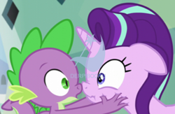 Size: 398x259 | Tagged: safe, edit, edited screencap, screencap, spike, starlight glimmer, dragon, pony, unicorn, derpibooru, derpibooru premium, face grab, meta, watermark