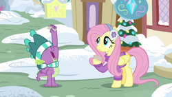 Size: 1280x720 | Tagged: safe, screencap, fluttershy, spike, dragon, pegasus, pony, best gift ever, clothes, earmuffs, hat, male, scarf, sweater, winged spike, winter outfit