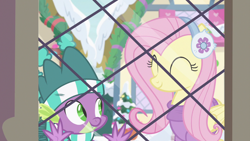 Size: 1280x720 | Tagged: safe, screencap, fluttershy, spike, dragon, pegasus, pony, best gift ever, clothes, cute, duo, earmuffs, eyes closed, female, hat, male, mare, scarf, shyabetes, snow, window