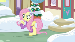 Size: 1280x720 | Tagged: safe, screencap, fluttershy, pegasus, pony, best gift ever, clothes, earmuffs, female, mare, snow, solo, sweater