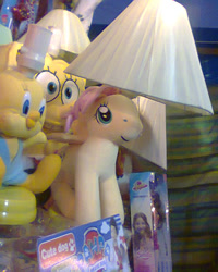 Size: 480x600 | Tagged: safe, fluttershy, pony, bootleg, irl, lamp, looney tunes, paw patrol, photo, plushie, spongebob squarepants, tweety bird, wat