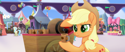 Size: 1920x804 | Tagged: safe, screencap, applejack, earth pony, pony, my little pony: the movie, applejack's hat, balloon, bow, cake, cart, cider, confused, cotton candy, cowboy hat, flag, food, hat, hoof hold, jug, mug, ribbon, serious, tankard