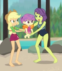 Size: 350x402 | Tagged: safe, screencap, applejack, victoria, water lily (equestria girls), better together, equestria girls, turf war, applejack's hat, baby, background human, barefoot, clothes, cowboy hat, cropped, feet, female, hat, legs, lifeguard applejack, mother, mother and child, mother and daughter, one-piece swimsuit, parent and child, shorts, swimming trunks, swimsuit, toddler