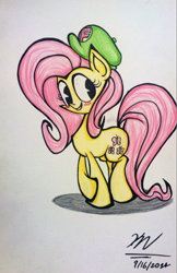 Size: 775x1199 | Tagged: safe, artist:evilstaplers, artist:pelate, fluttershy, pegasus, pony, blushing, cute, female, hat, looking away, looking sideways, mare, shy, smiling, solo, standing, traditional art, wingless