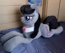 Size: 3152x2554 | Tagged: safe, artist:adamar44, octavia melody, earth pony, pony, bed, bowtie, female, irl, lidded eyes, mare, photo, plushie, smiling