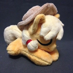 Size: 960x960 | Tagged: safe, artist:burgunzik, applejack, pony, chibi, irl, photo, plushie, prone, solo