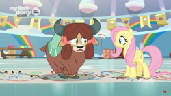 Size: 1366x768 | Tagged: safe, screencap, fluttershy, yona, pegasus, pony, yak, she's all yak, bow, cloven hooves, crossed hooves, dotted line, duo, female, gym, hair bow, hoofprints, mare, monkey swings, paper, twisting