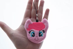 Size: 1000x674 | Tagged: safe, artist:meplushyou, pinkie pie, earth pony, human, pony, charm, female, hand, irl, irl human, looking at you, mare, photo, plushie, smiling