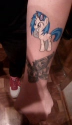 Size: 1155x1986 | Tagged: safe, dj pon-3, vinyl scratch, pony, clothes, irl, photo, russia, tattoo