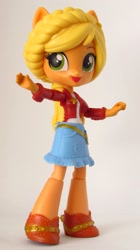 Size: 1101x1970 | Tagged: safe, artist:whatthehell!?, applejack, equestria girls, clothes, doll, equestria girls minis, eqventures of the minis, irl, merchandise, photo, ponied up, shoes, skirt, theme park, toy