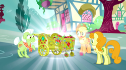 Size: 1440x807 | Tagged: safe, screencap, applejack, carrot top, golden harvest, granny smith, earth pony, pony, inspiration manifestation, apple, apple cart, bedazzled, female, food, gem, gold, mare, raised hoof, shiny, surprised, trio