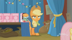 Size: 1348x754 | Tagged: safe, screencap, applejack, fluttershy, earth pony, pegasus, pony, best gift ever, discovery family logo, holly the hearths warmer doll, unamused