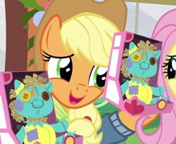 Size: 878x720 | Tagged: safe, screencap, applejack, earth pony, pony, best gift ever, cropped, female, holly the hearths warmer doll, mare, solo focus, yay