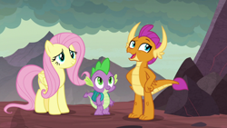 Size: 1920x1080 | Tagged: safe, screencap, fluttershy, smolder, spike, dragon, pegasus, pony, sweet and smoky, baby, baby dragon, backpack, claws, dragon lands, dragoness, fangs, female, folded wings, friends, horns, mare, open mouth, smiling, teenaged dragon, teenager, trio, winged spike, wings